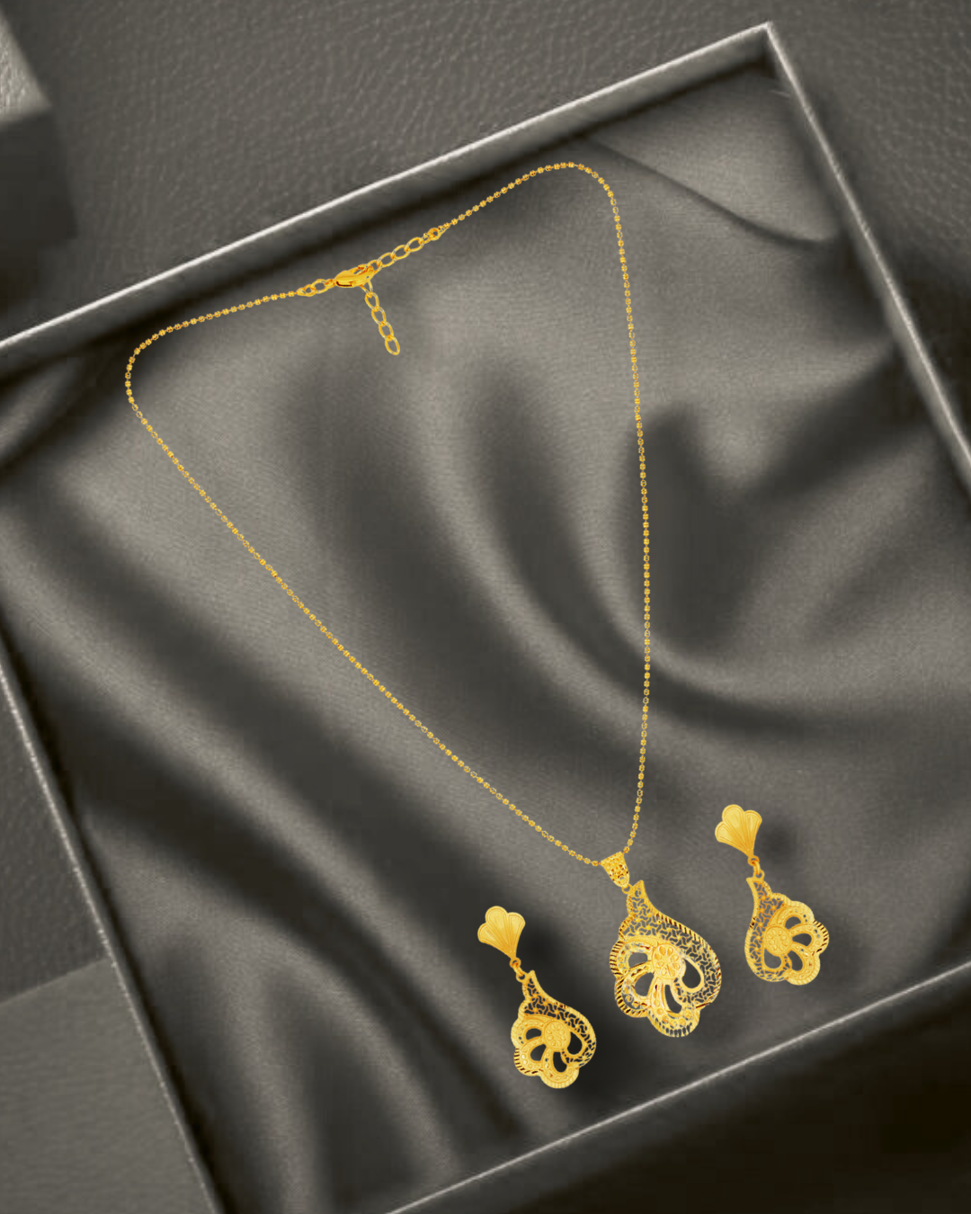 45 Elegant Gold-Toned Paisley Pendant Set with Earrings - Image 1
